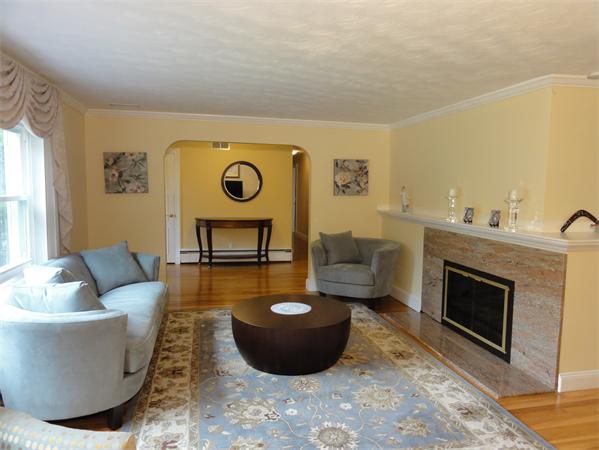 156 Pleasant Street Lexington, MA 02421 - Photo 6 of 28 a living room with furniture and a fireplace