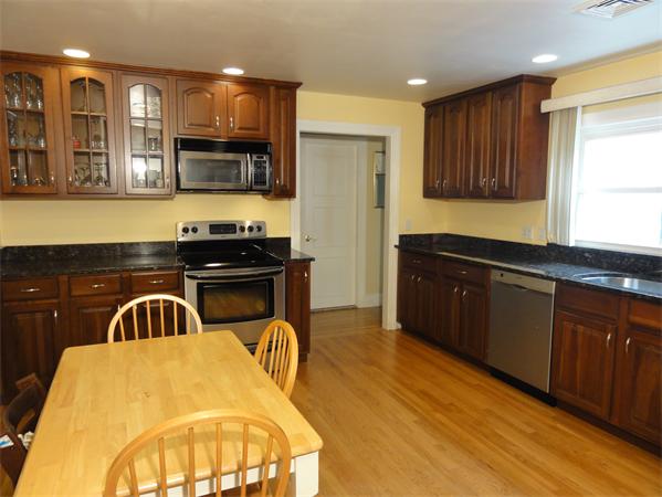 156 Pleasant Street Lexington, MA 02421 - Photo 9 of 28 a kitchen with a sink appliances and cabinets