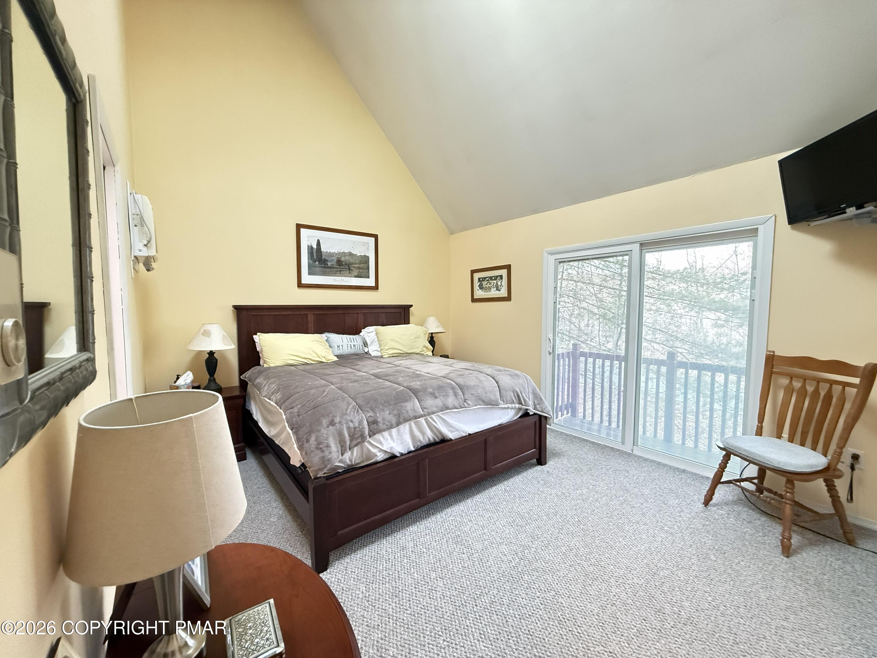 5933 Decker Road Bushkill, PA 18324 - Photo 11 of 51 a bedroom with a bed chair and a window