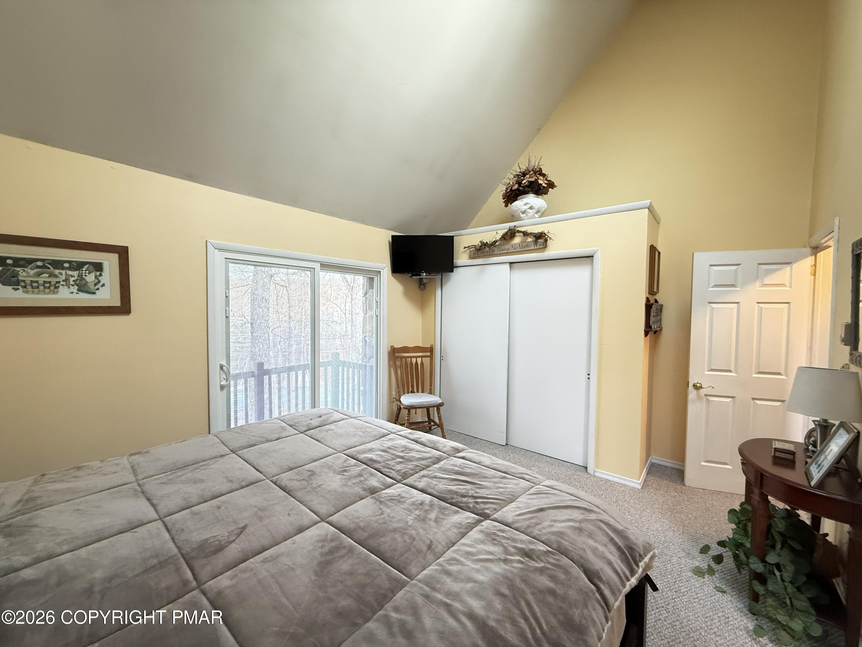 5933 Decker Road Bushkill, PA 18324 - Photo 12 of 51 a bedroom with a bed and a chair