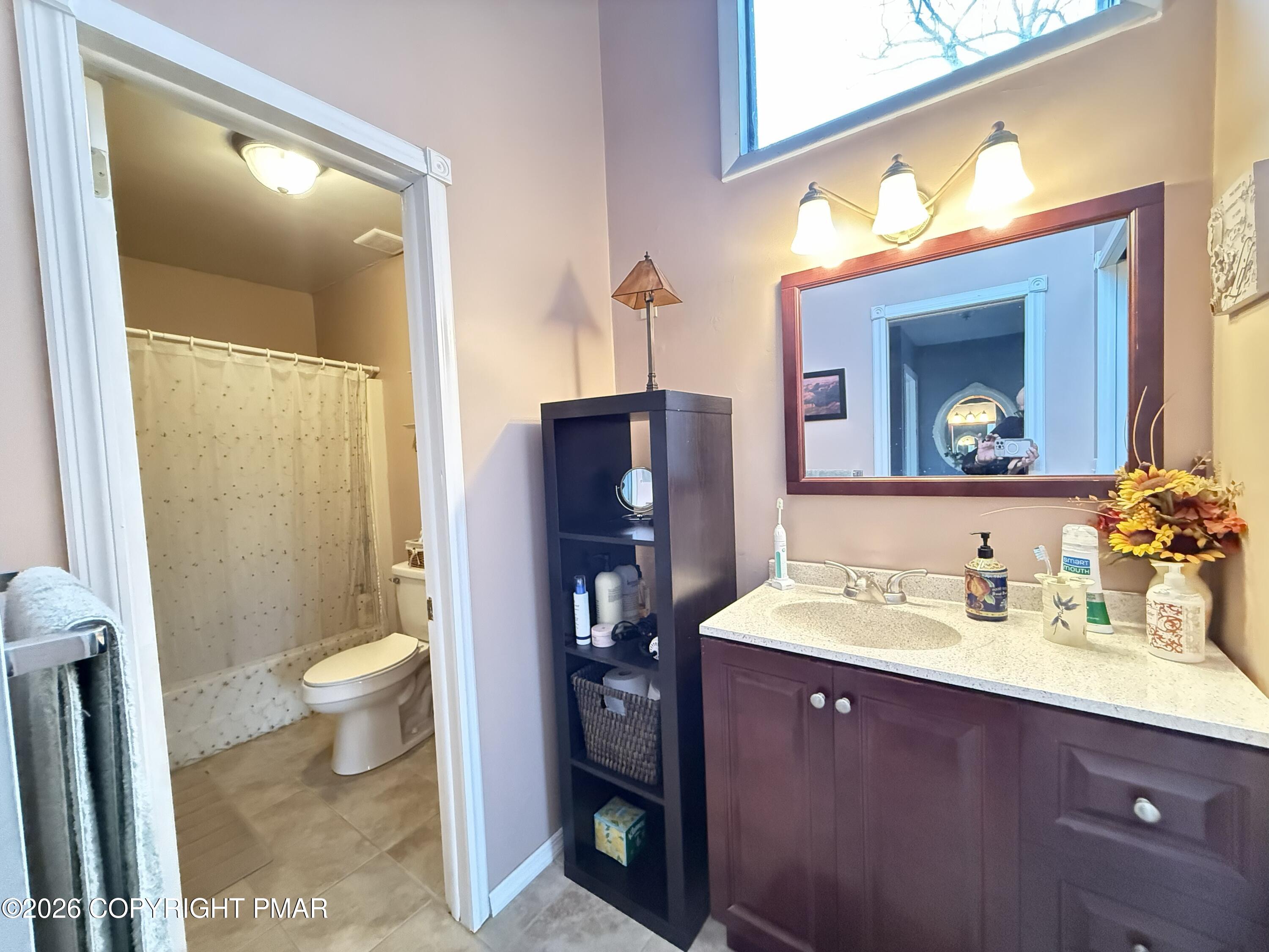 5933 Decker Road Bushkill, PA 18324 - Photo 14 of 51 a bathroom with a sink vanity and a toilet