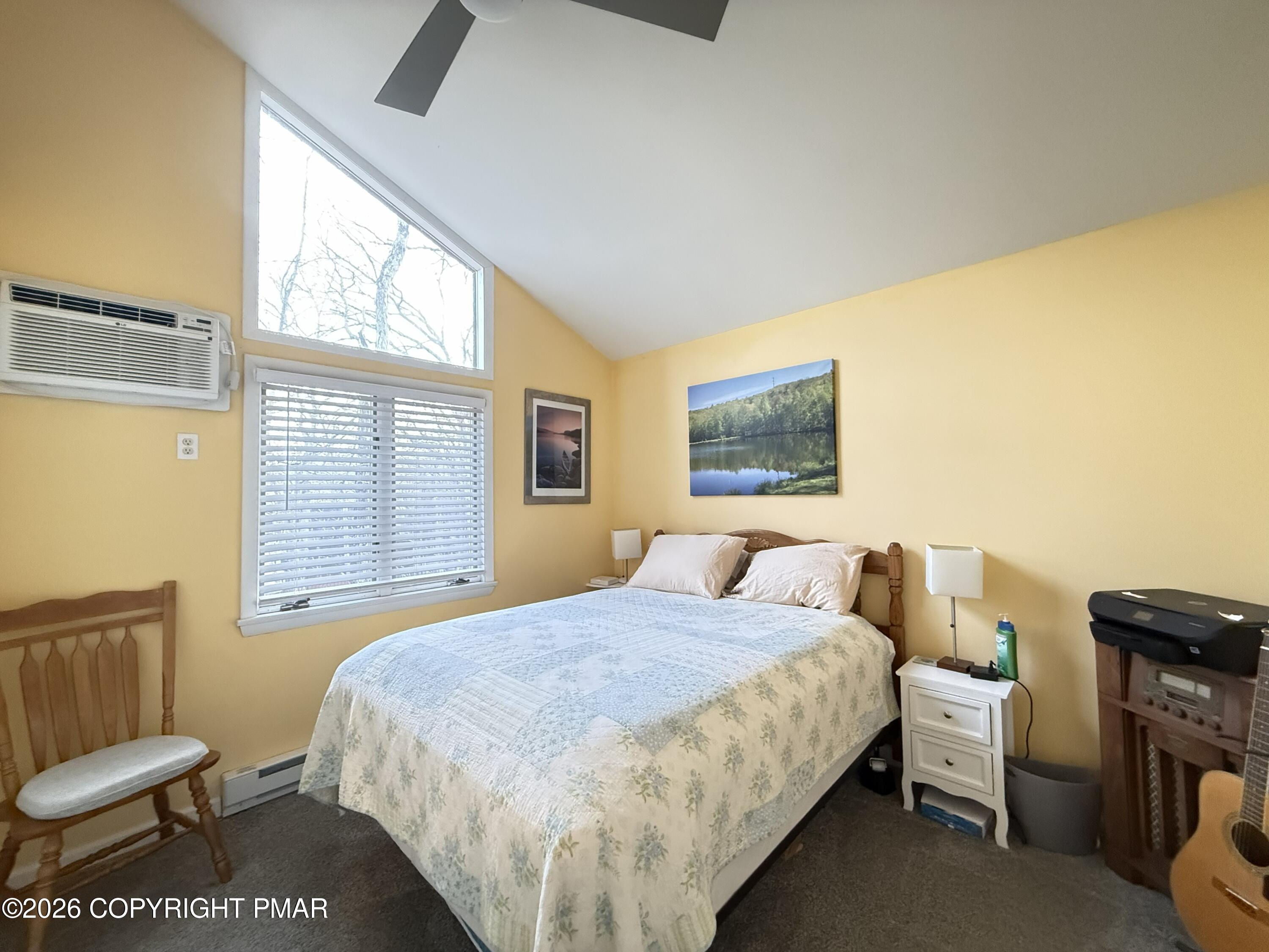 5933 Decker Road Bushkill, PA 18324 - Photo 17 of 51 a bedroom with a bed and wooden floor