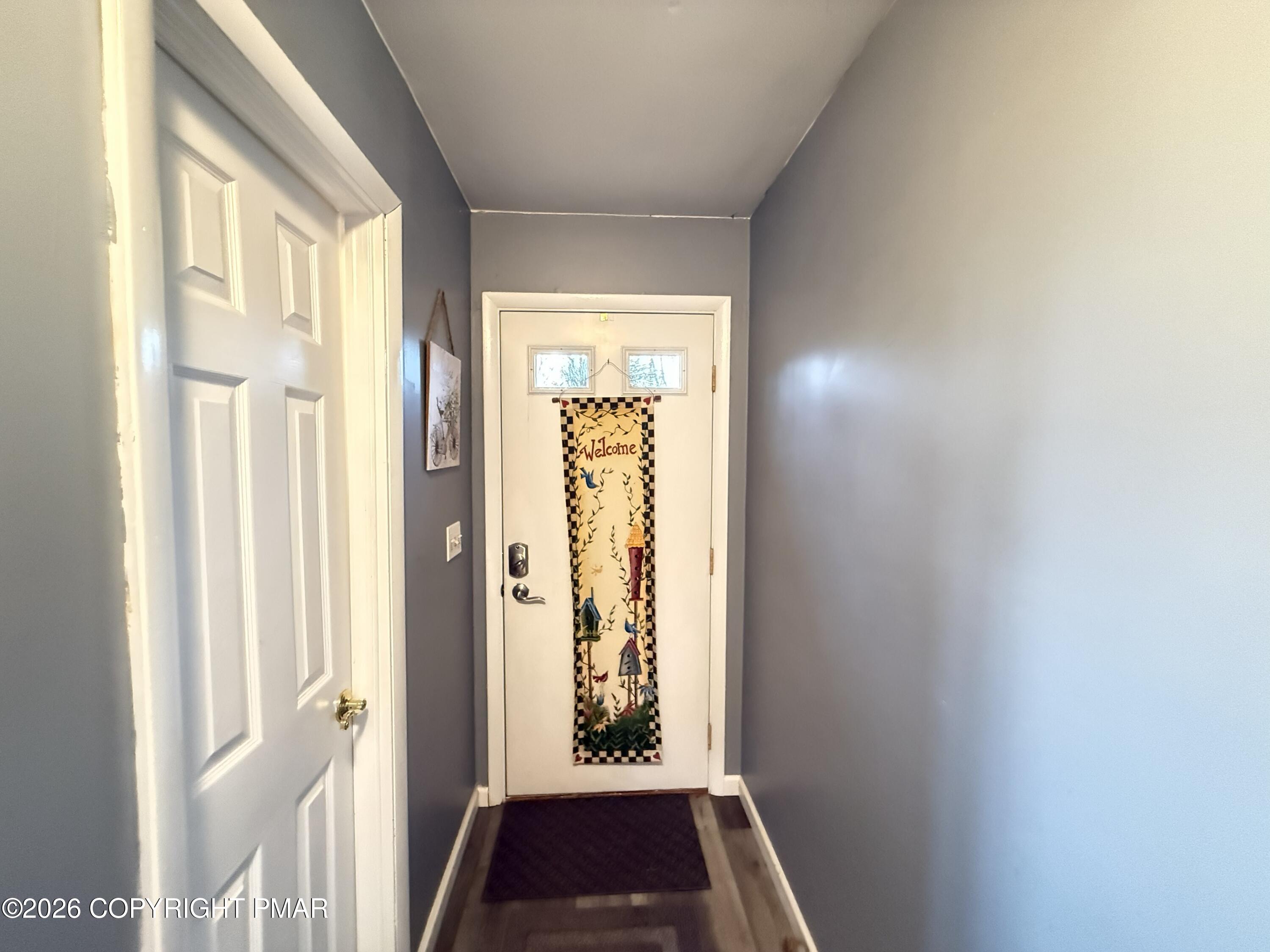 5933 Decker Road Bushkill, PA 18324 - Photo 24 of 51 a view of a hallway with wooden floor and windows