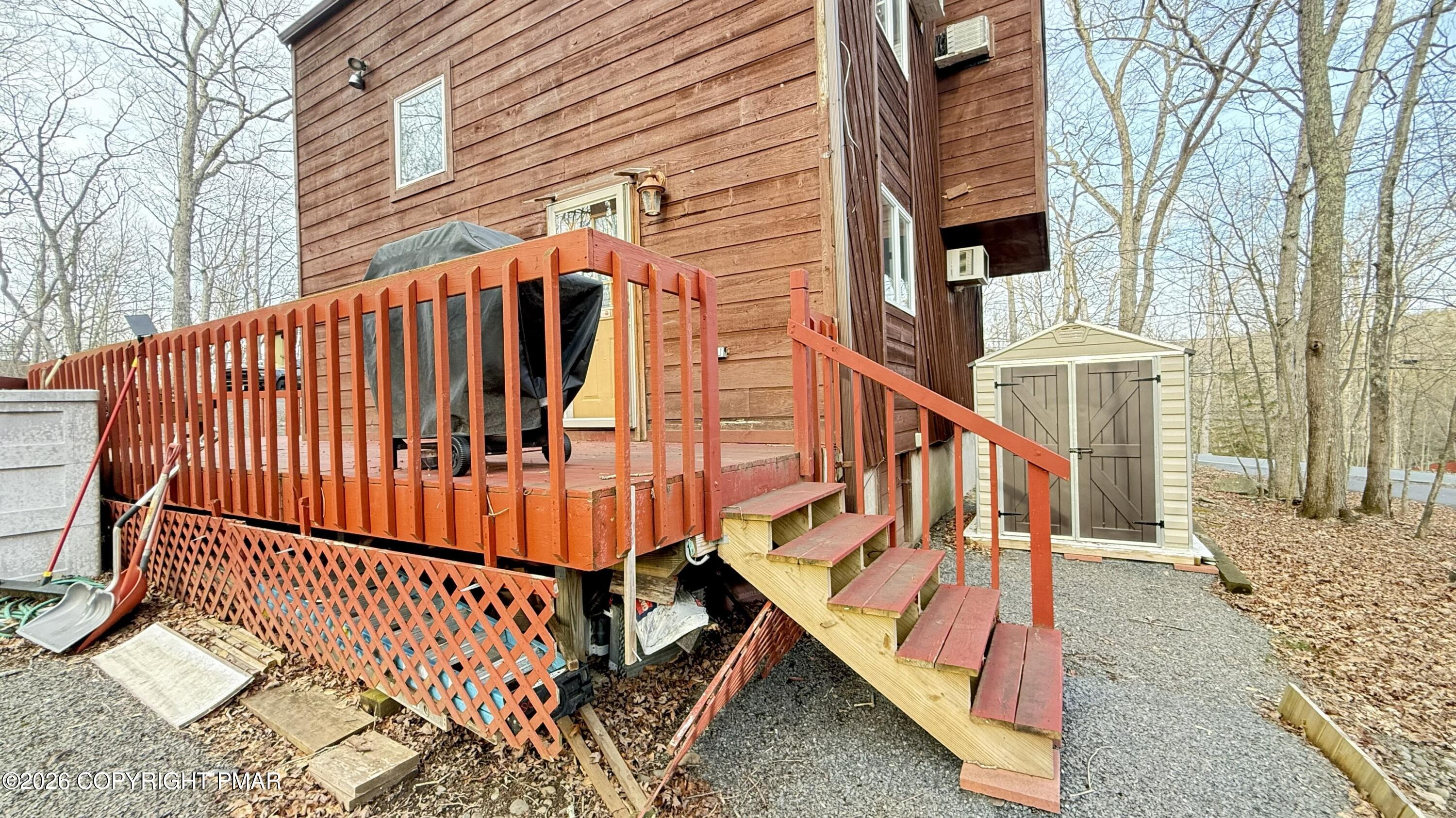 5933 Decker Road Bushkill, PA 18324 - Photo 27 of 51 a view of entryway with wooden stairs