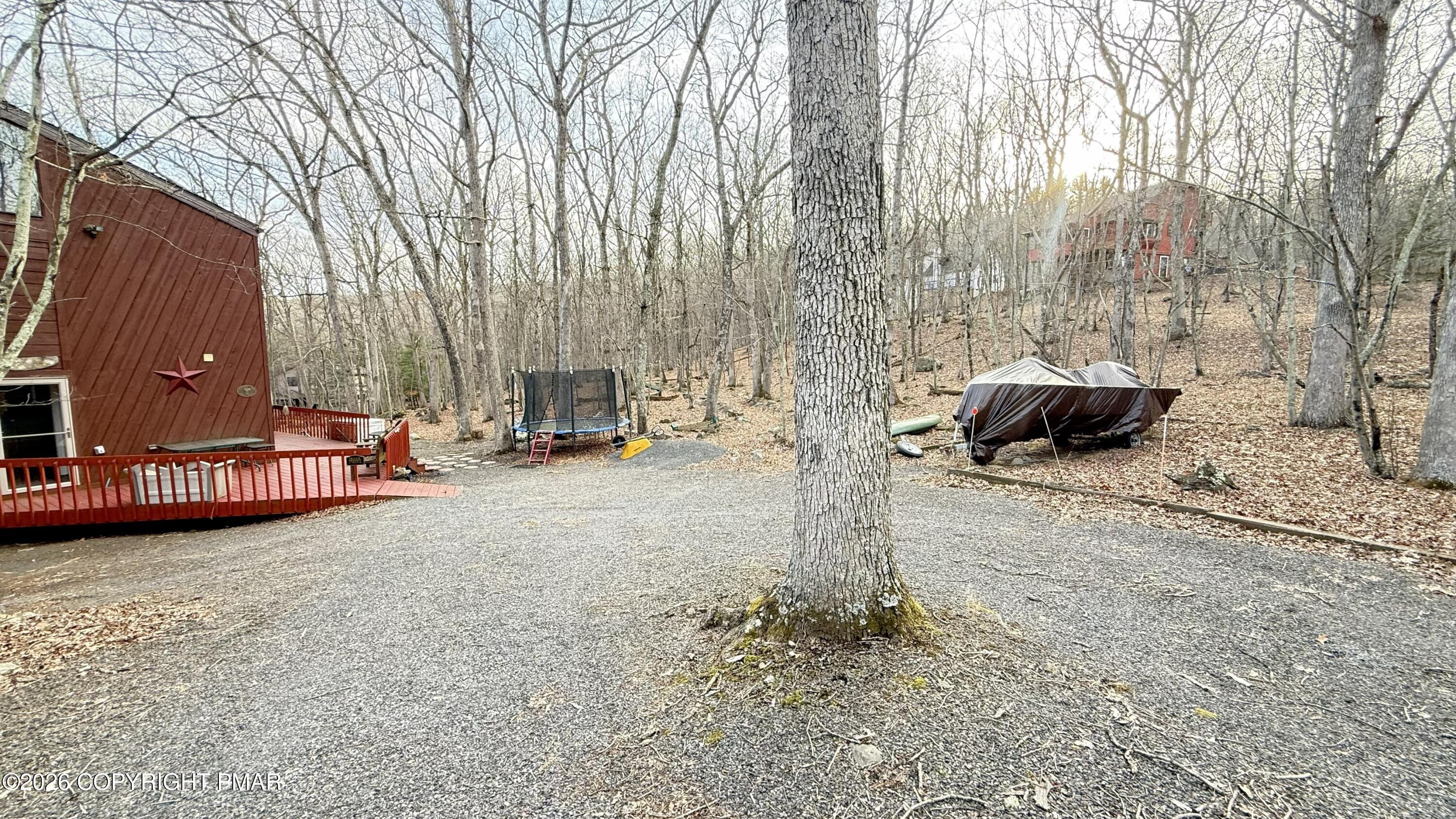 5933 Decker Road Bushkill, PA 18324 - Photo 3 of 51 a view of a street with a bench and trees