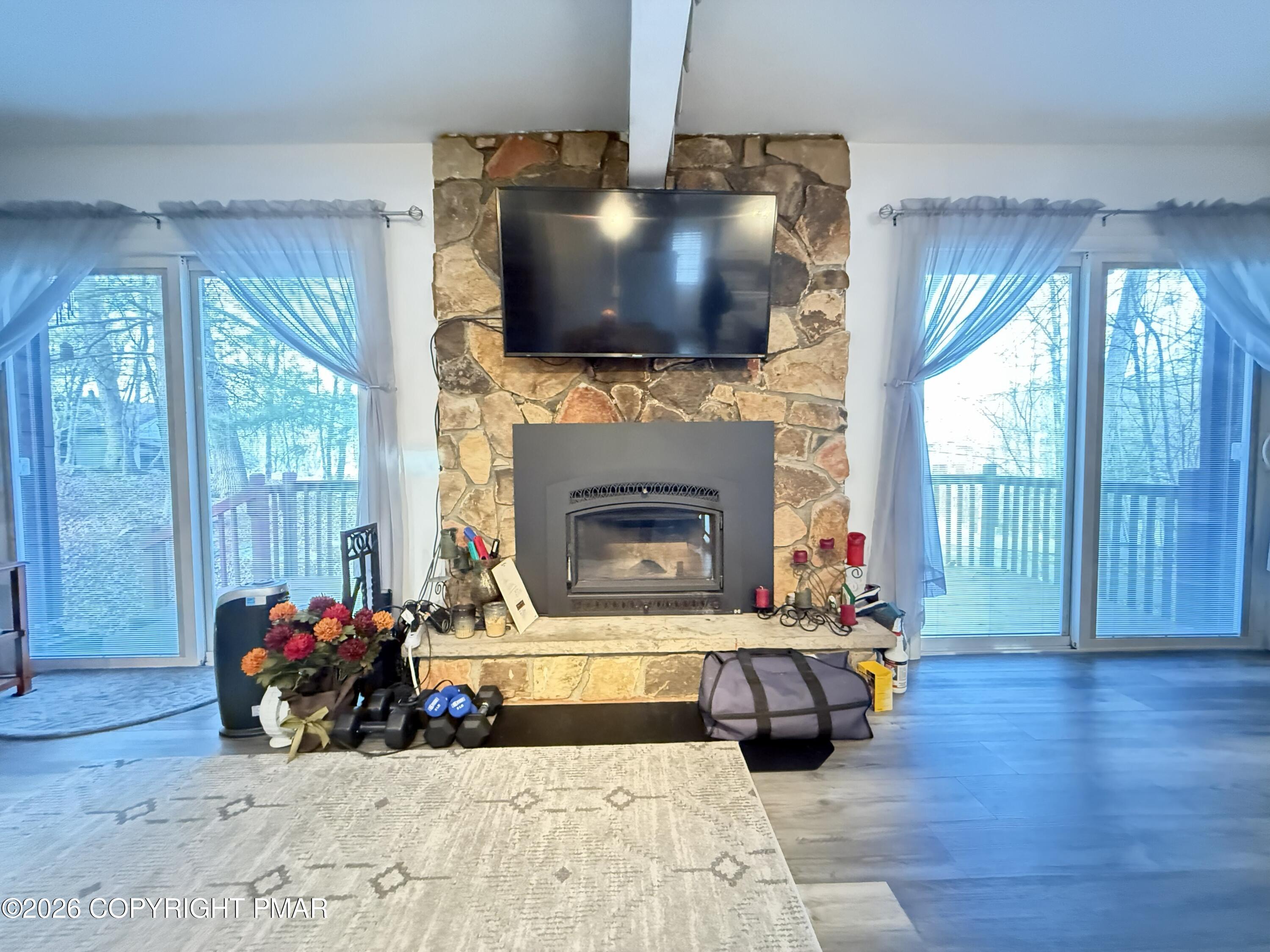 5933 Decker Road Bushkill, PA 18324 - Photo 7 of 51 a living room with furniture and a flat screen tv