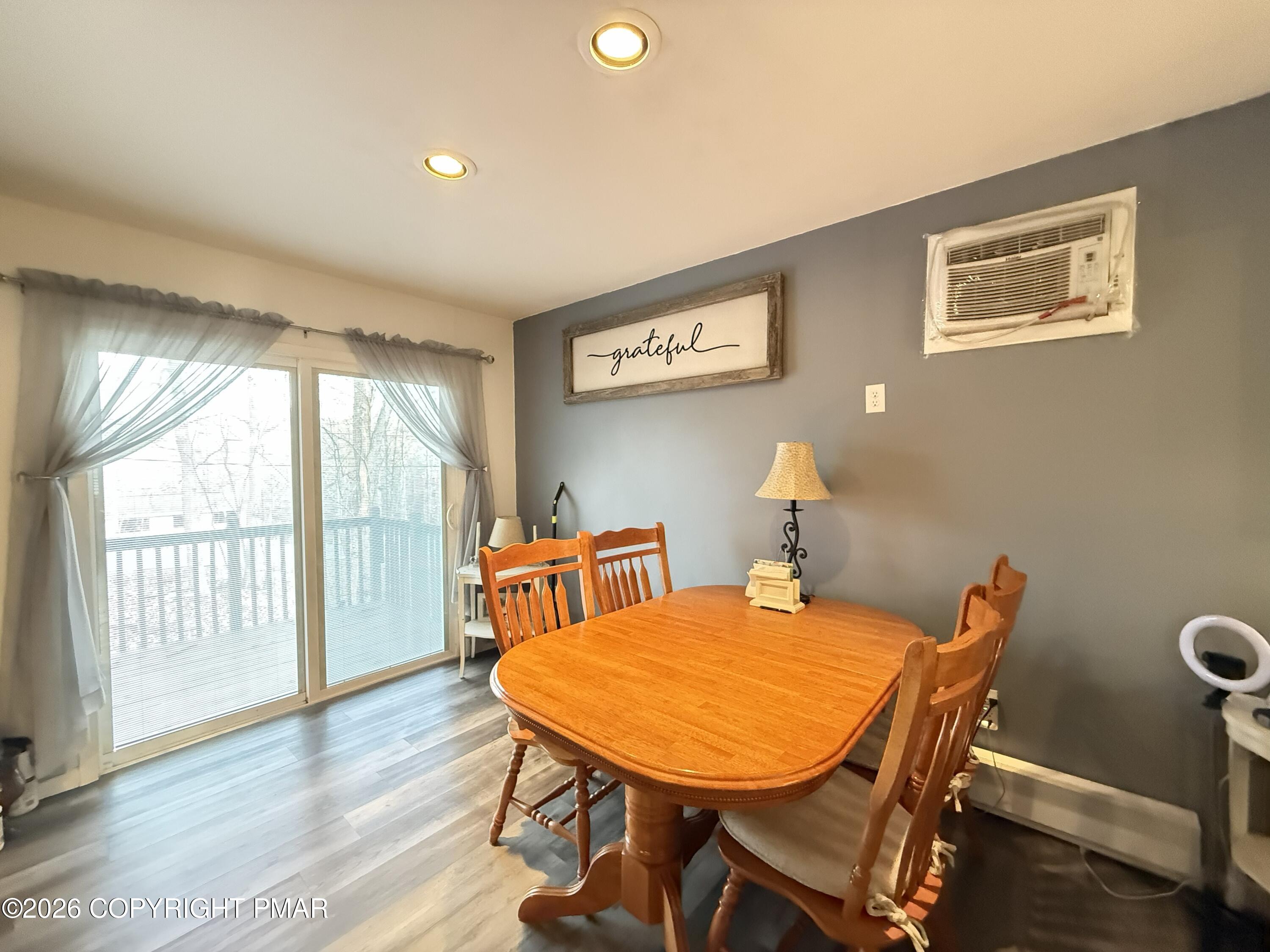 5933 Decker Road Bushkill, PA 18324 - Photo 9 of 51 a view of a dining room with furniture and wooden floor