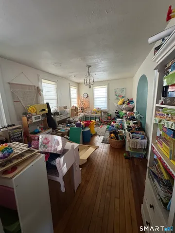 a bathroom with a double vanity sink toilet and mirror