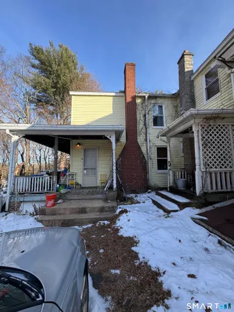 a front view of a house with parking