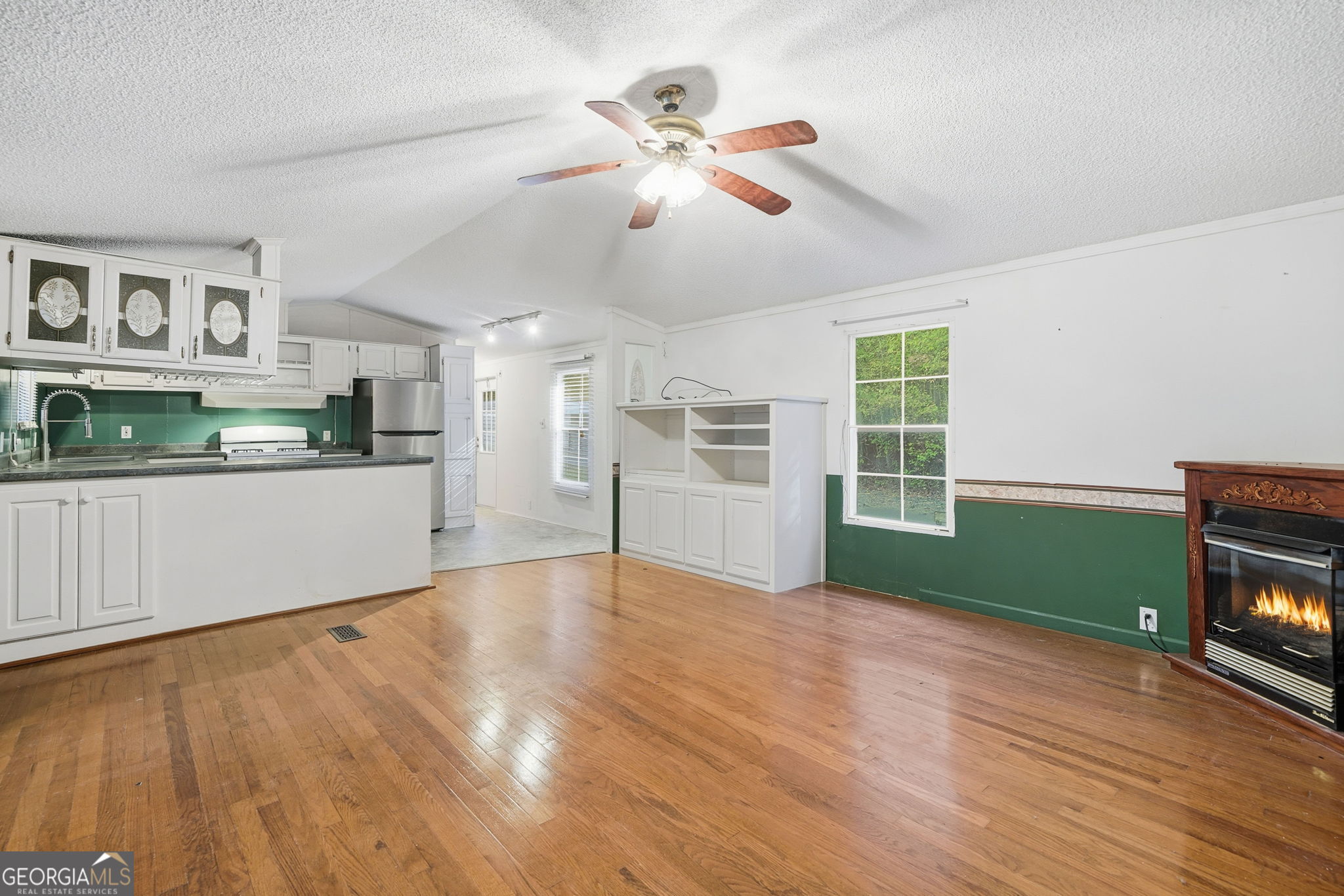 1907 John Call Road Ellijay, GA 30536 - Photo 17 of 41 a view of empty room with wooden floor and fan