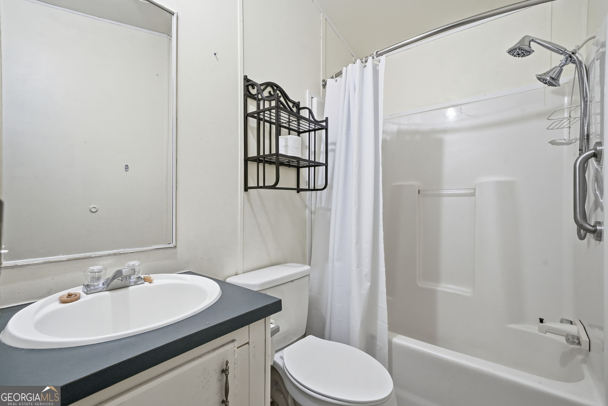 1907 John Call Road Ellijay, GA 30536 - Photo 33 of 41 a bathroom with a sink toilet and shower