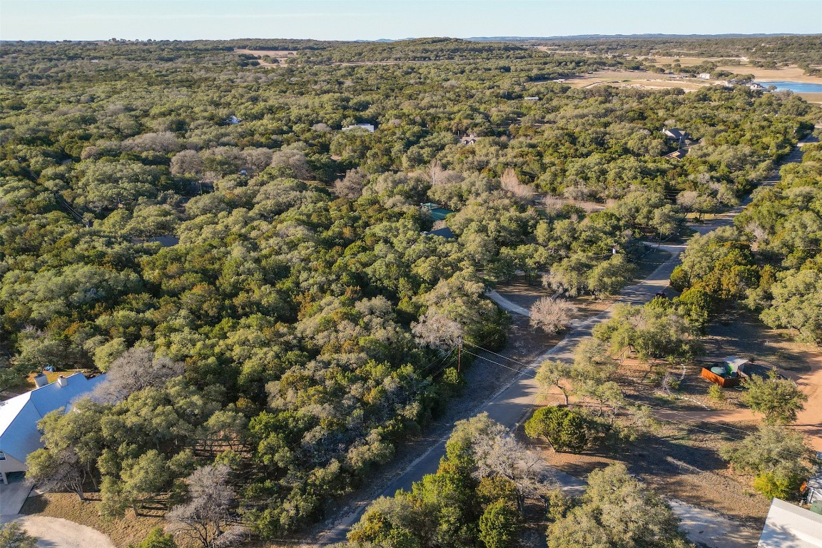 308 Ridge Oak Drive Wimberley, TX 78676 - Photo 12 of 29 Lot has 125' frontage on Ridge Oak. Located to right of utility pole and before the circular drive to the right.
