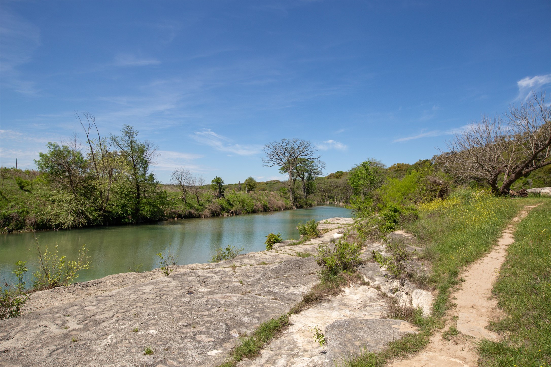 308 Ridge Oak Drive Wimberley, TX 78676 - Photo 7 of 29 a view of a lake with houses in the back