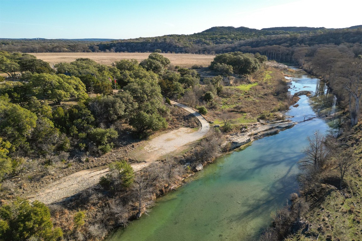 308 Ridge Oak Drive Wimberley, TX 78676 - Photo 9 of 29 View of the drive down to the river park's parking area.
