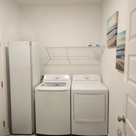 a utility room with dryer and washer