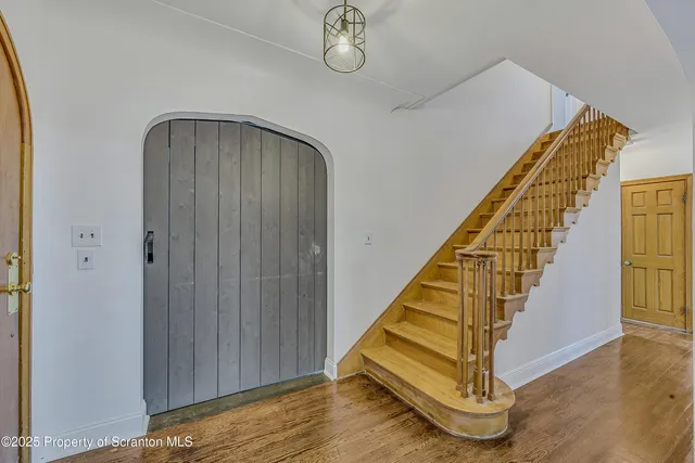 a view of entryway with wooden floor