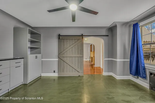 a view of an empty room with a window