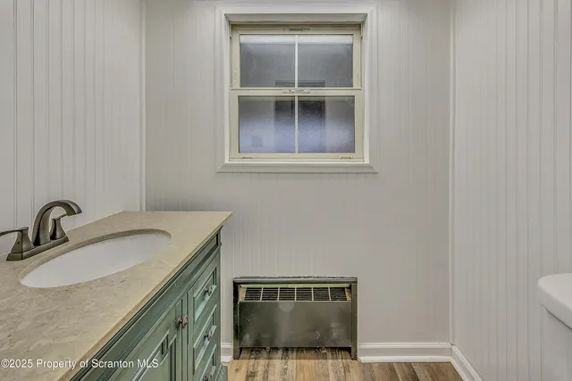 a bathroom with a sink and a toilet