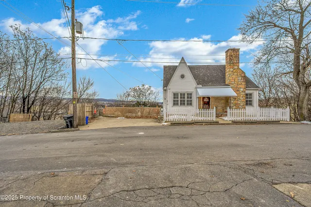 a view of a street with a house