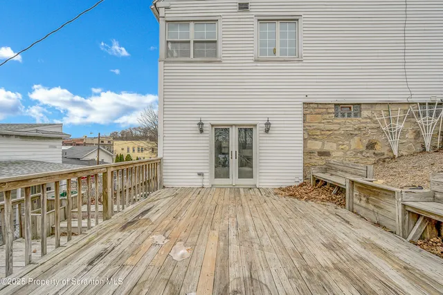 a view of a balcony with wooden floor