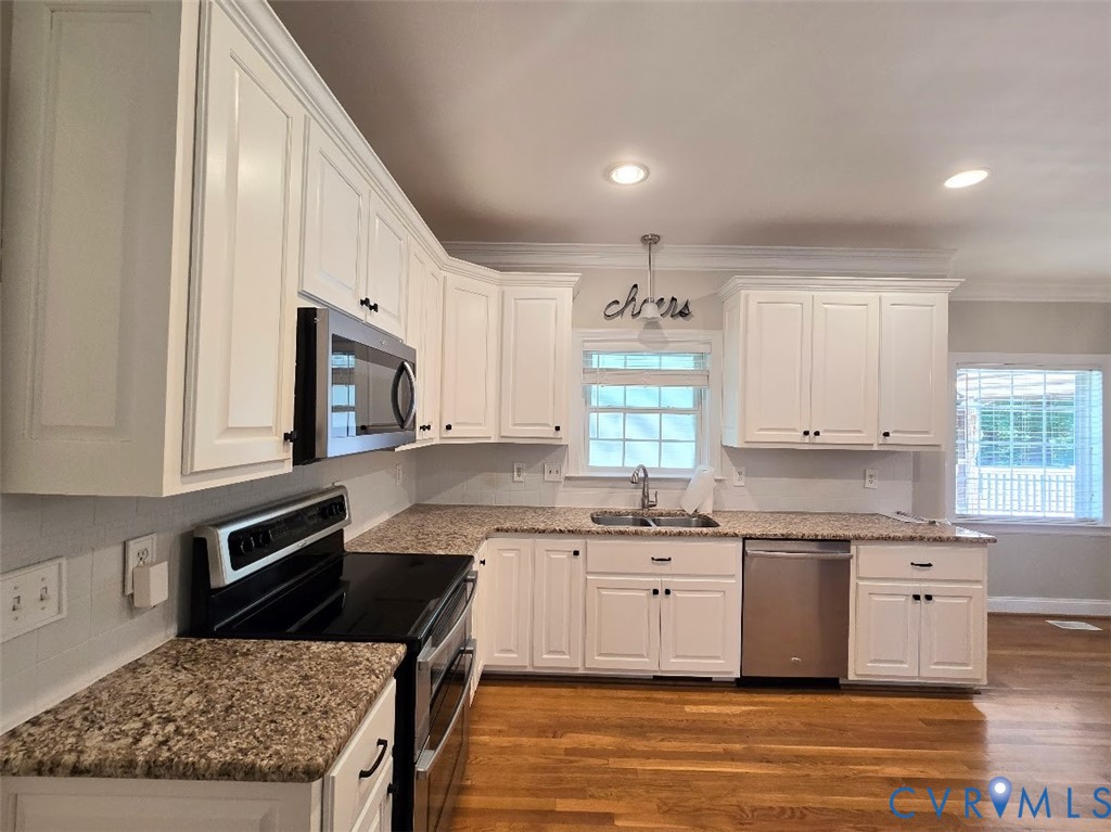 16406 Benmore Road Moseley, VA 23120 - Photo 6 of 32 a kitchen with stainless steel appliances granite countertop a stove a sink and a microwave