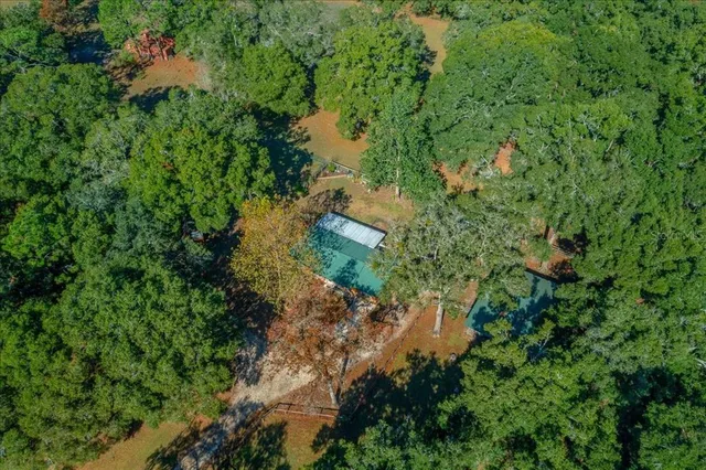 a view of a house with yard and sitting area