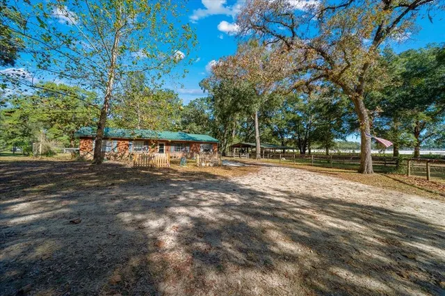 a bathroom with a sink a toilet and shower curtain