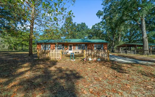 a bed room with a bed and a ceiling fan