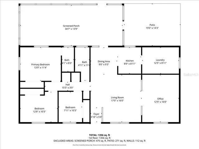 a view of a wooden house with large trees