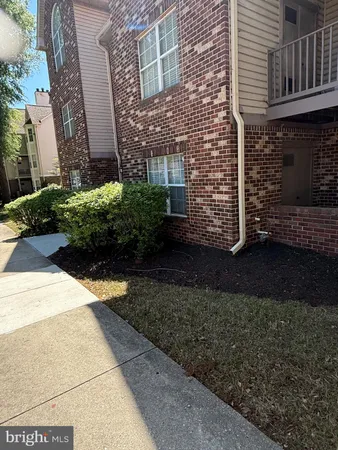a view of a pathway both side of house