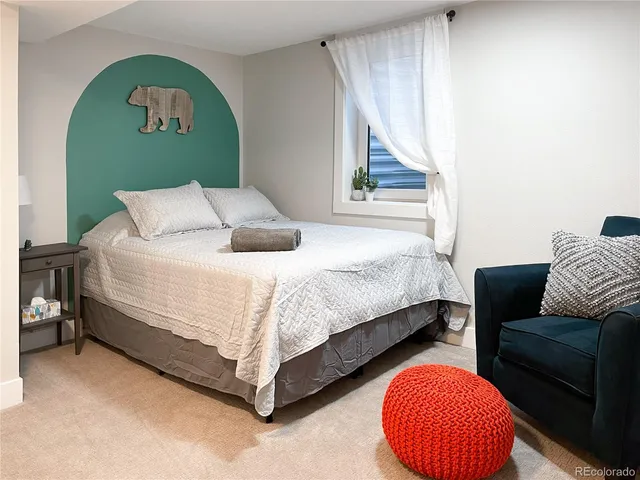 a bedroom with a bed and window