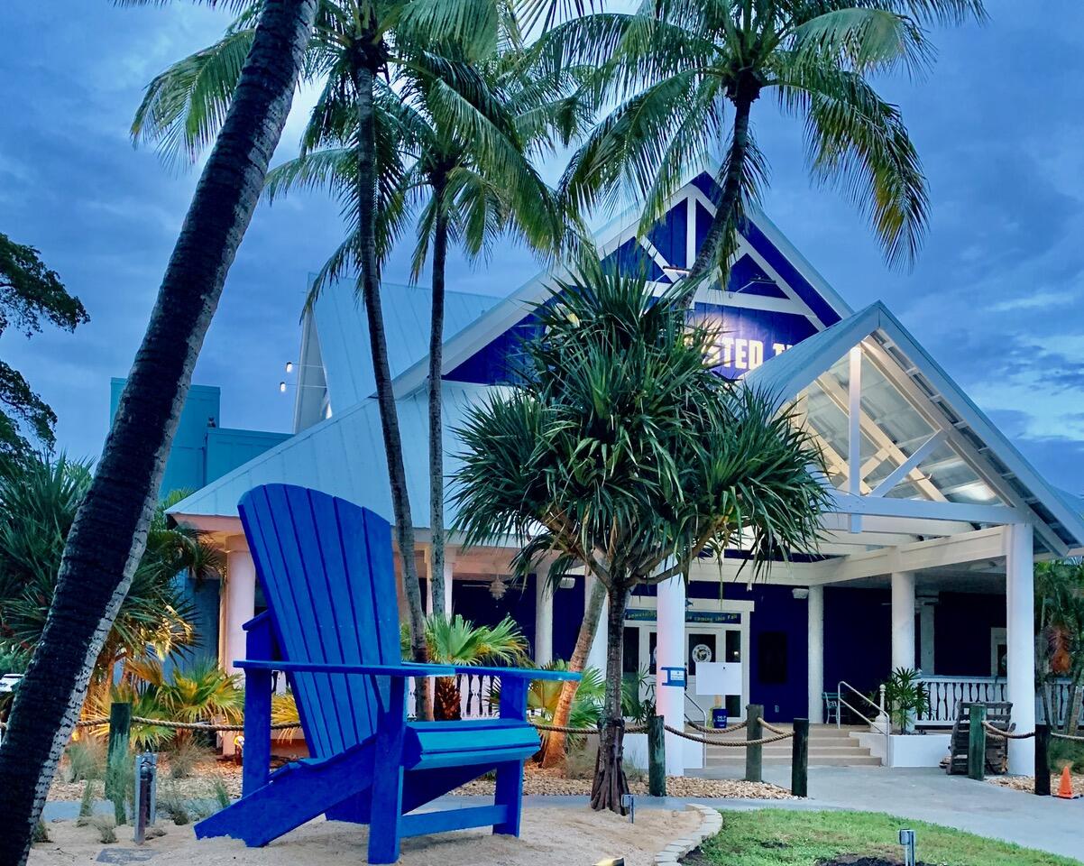353 Highway 1, Unit C7 Jupiter, FL 33477 - Photo 16 of 25 a palm tree sitting in front of a building