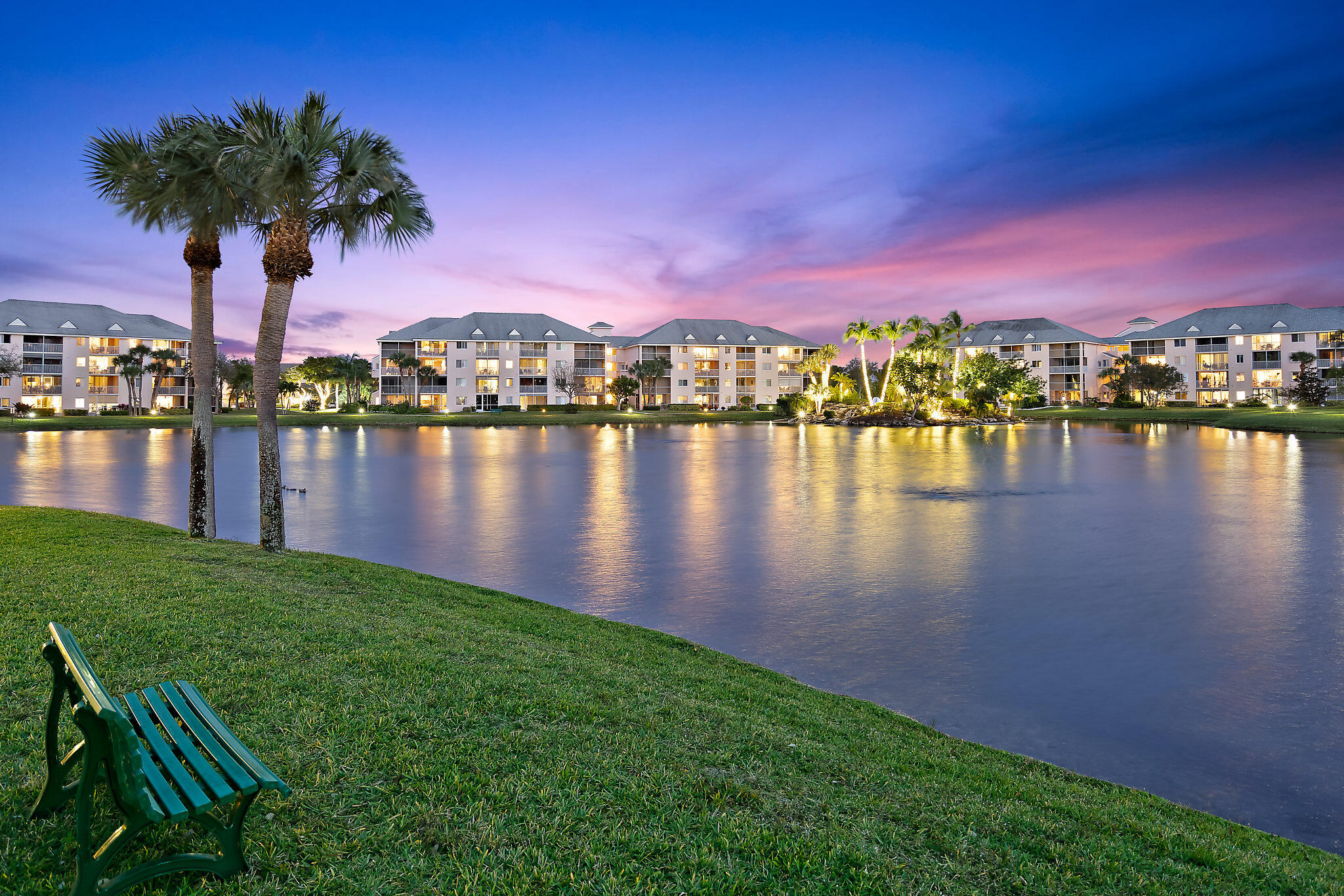 353 Highway 1, Unit C7 Jupiter, FL 33477 - Photo 17 of 25 a view of a lake with a table and chairs