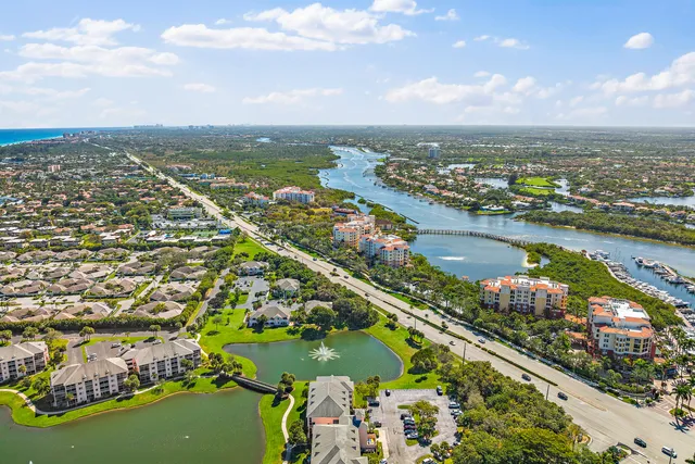 an aerial view of city and lake