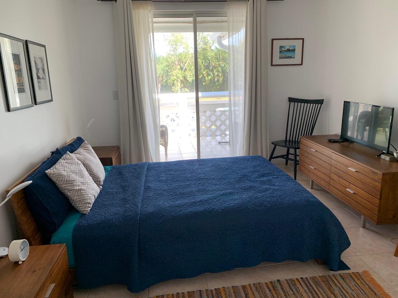 353 Highway 1, Unit C7 Jupiter, FL 33477 - Photo 10 of 25 a bedroom with a bed and window