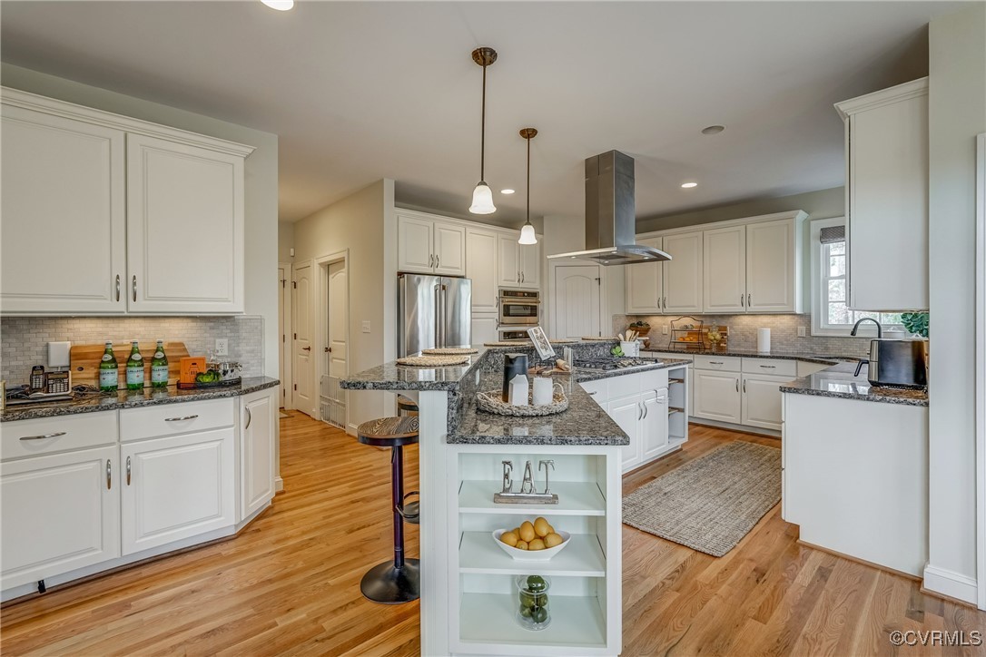 3412 Handley Road Midlothian, VA 23113 - Photo 16 of 50 a kitchen with kitchen island white cabinets and stainless steel appliances