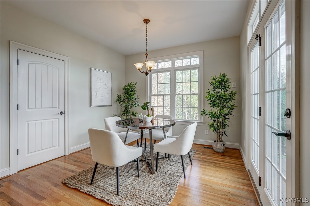 3412 Handley Road Midlothian, VA 23113 - Photo 20 of 50 a view of a dining room with furniture window and wooden floor