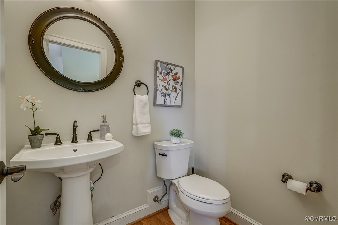 3412 Handley Road Midlothian, VA 23113 - Photo 23 of 50 a bathroom with a toilet sink and mirror