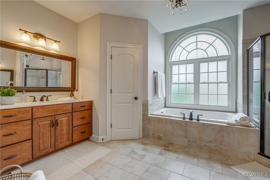 3412 Handley Road Midlothian, VA 23113 - Photo 28 of 50 a spacious bathroom with a tub a sink and mirror