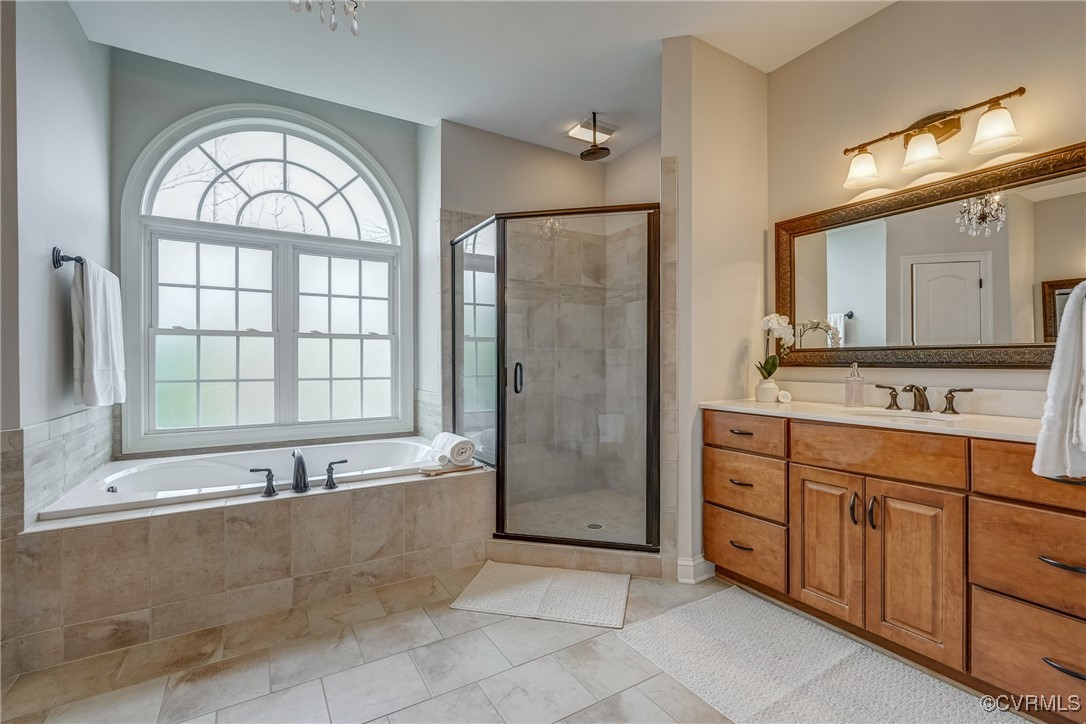3412 Handley Road Midlothian, VA 23113 - Photo 29 of 50 a spacious bathroom with a tub a sink and mirror