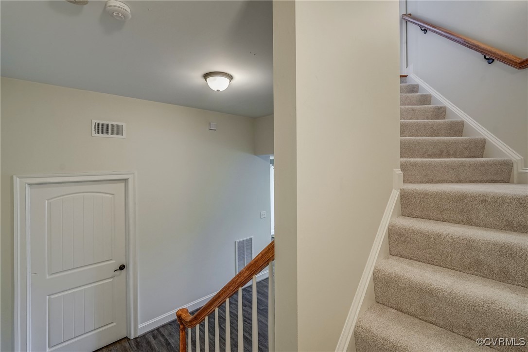 3412 Handley Road Midlothian, VA 23113 - Photo 41 of 50 a view of staircase with lots of frames on wall