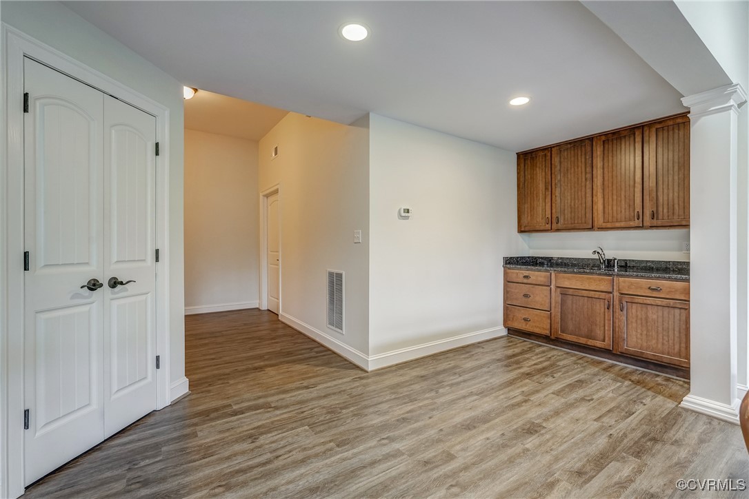 3412 Handley Road Midlothian, VA 23113 - Photo 42 of 50 a view of cabinets with wooden floor and electronic appliances