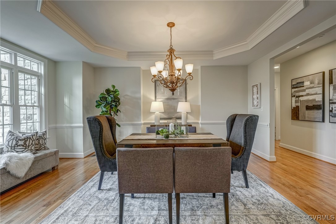 3412 Handley Road Midlothian, VA 23113 - Photo 7 of 50 a dining room with furniture a chandelier and wooden floor