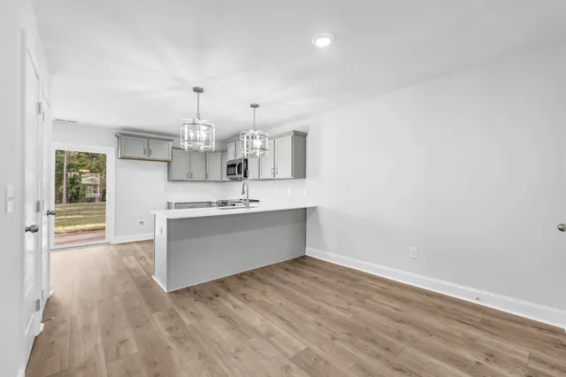 a view of a kitchen with electric appliances