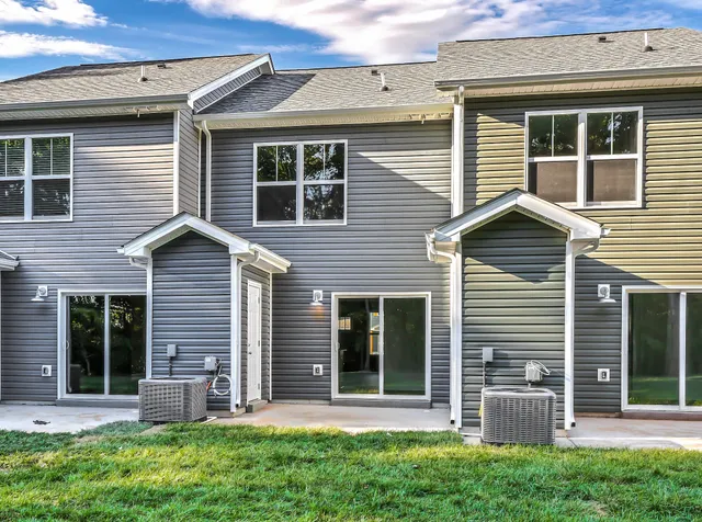 a view of house with yard