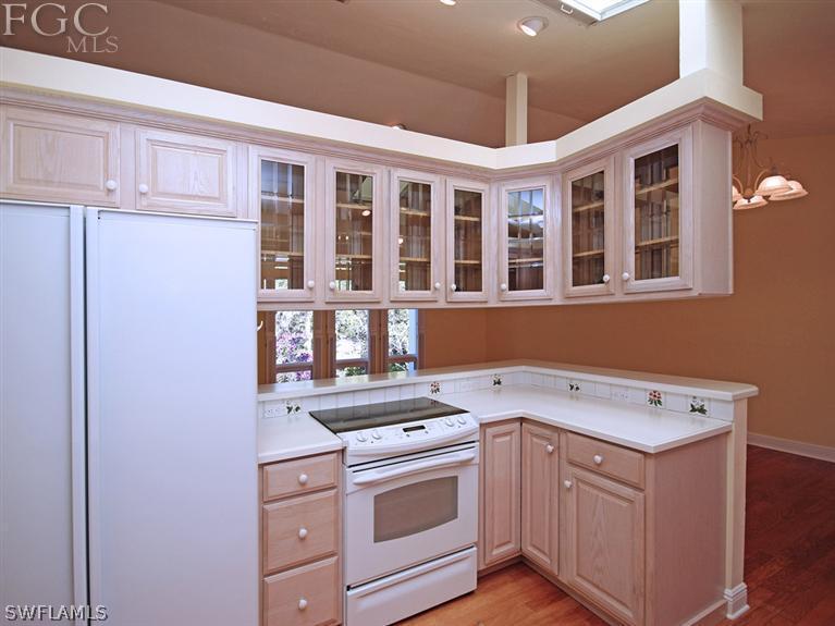 916 Beach Road Sanibel, FL 33957 - Photo 4 of 14 a view of a kitchen with stainless steel appliances granite countertop a stove and a sink