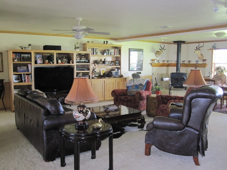 43763 McArthur Road Fall River Mills, CA 96028 - Photo 34 of 46 a living room with furniture and a flat screen tv