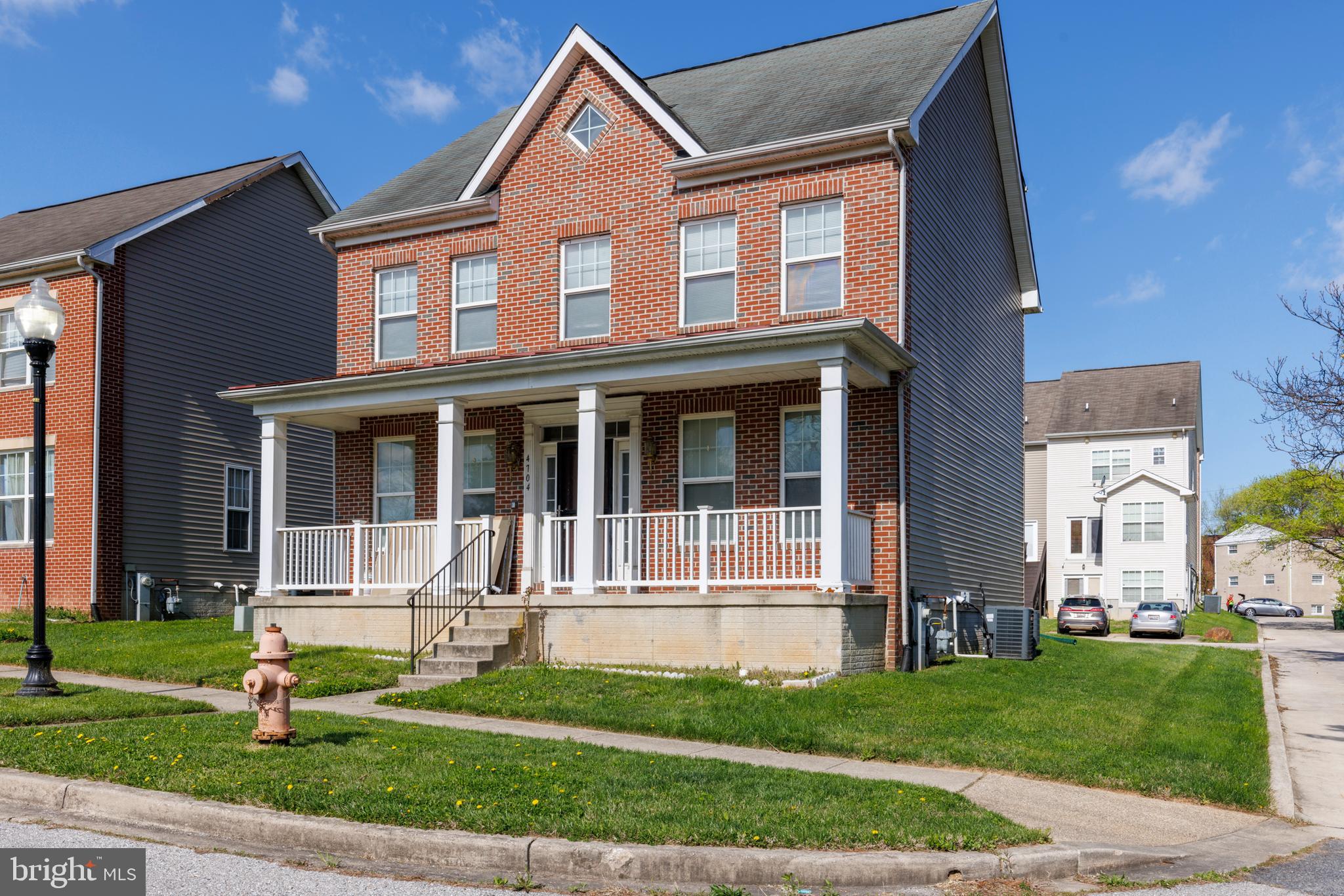 4704 Denview Way Baltimore, MD 21206 - Photo 3 of 42 a front view of a house with a yard