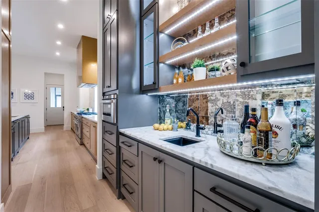 a kitchen with lots of counter top space and stainless steel appliances