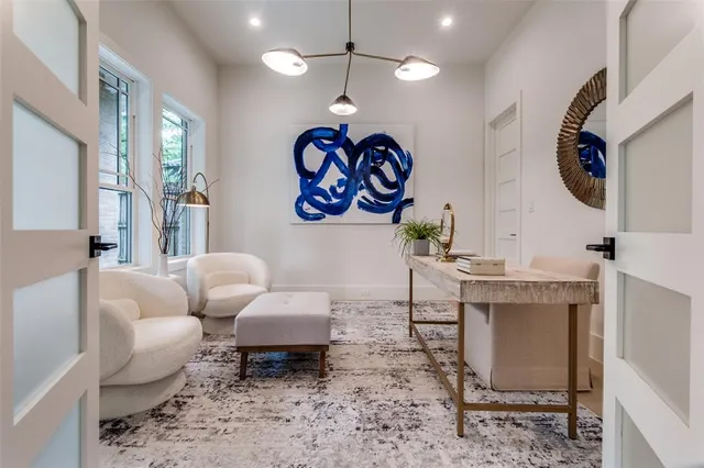 a living room with furniture and a white walls